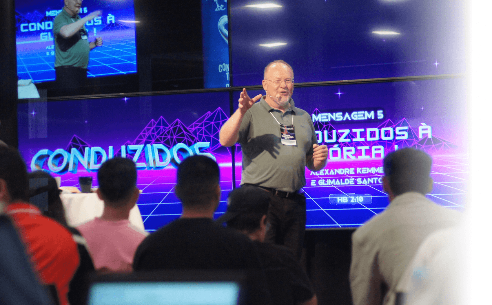 Brother delivering the message at the Youth Conference with the audience listening attentively