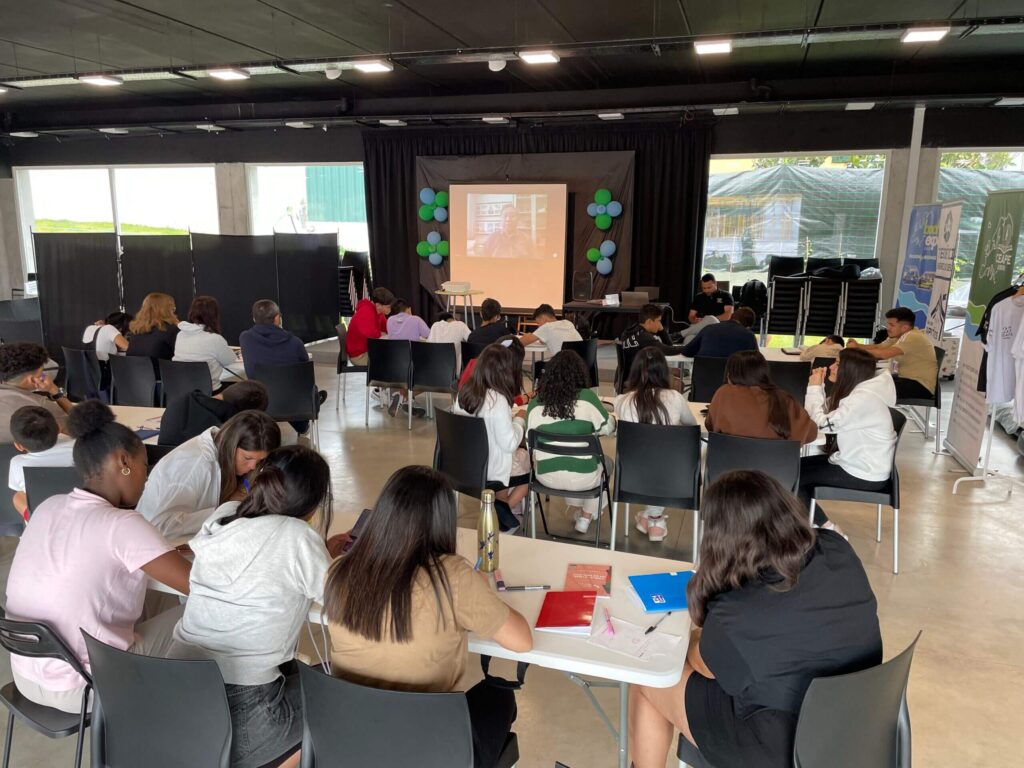 Young people and adolescents transcribing the Word from a message on YouTube