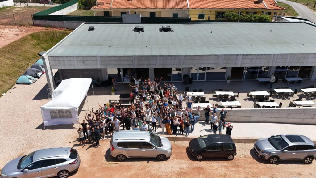 Drone photo of the COE with brothers outside greeting